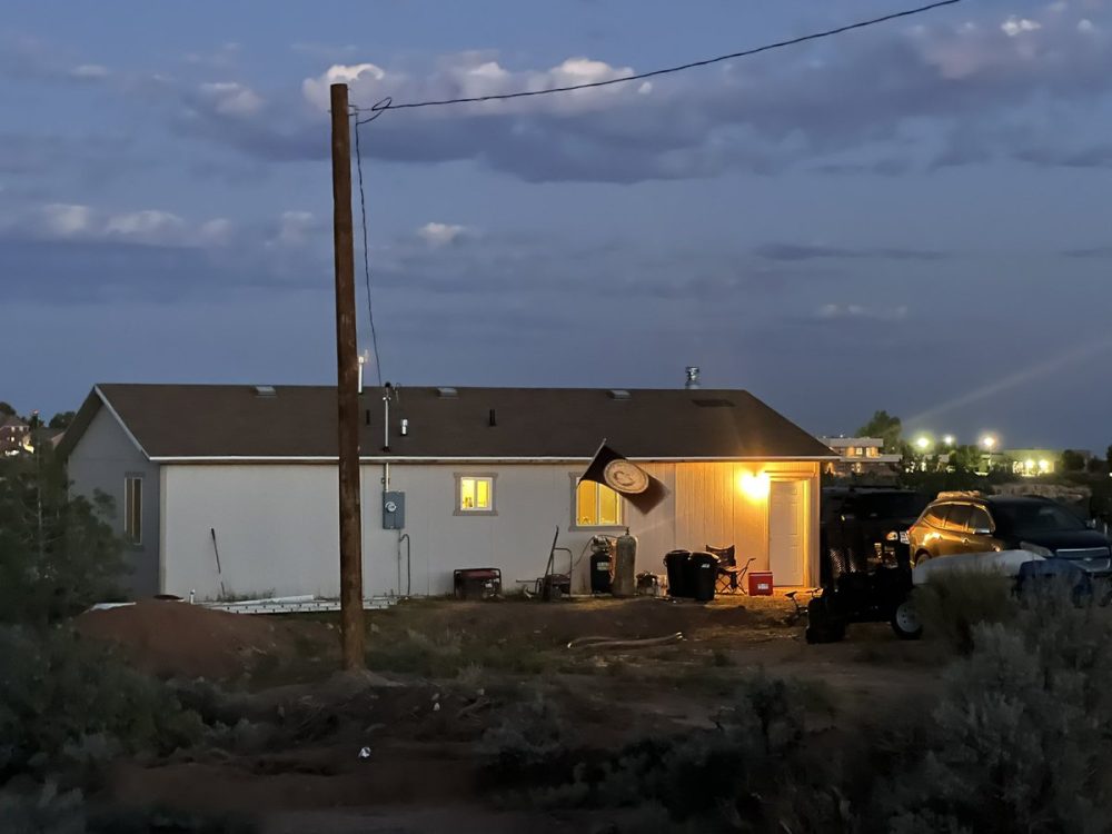 Featured image for “Long in the dark, lights illuminate Diné community of Westwater after electrification effort reaches completion”